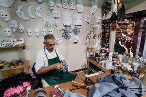 A mask maker in his workshop